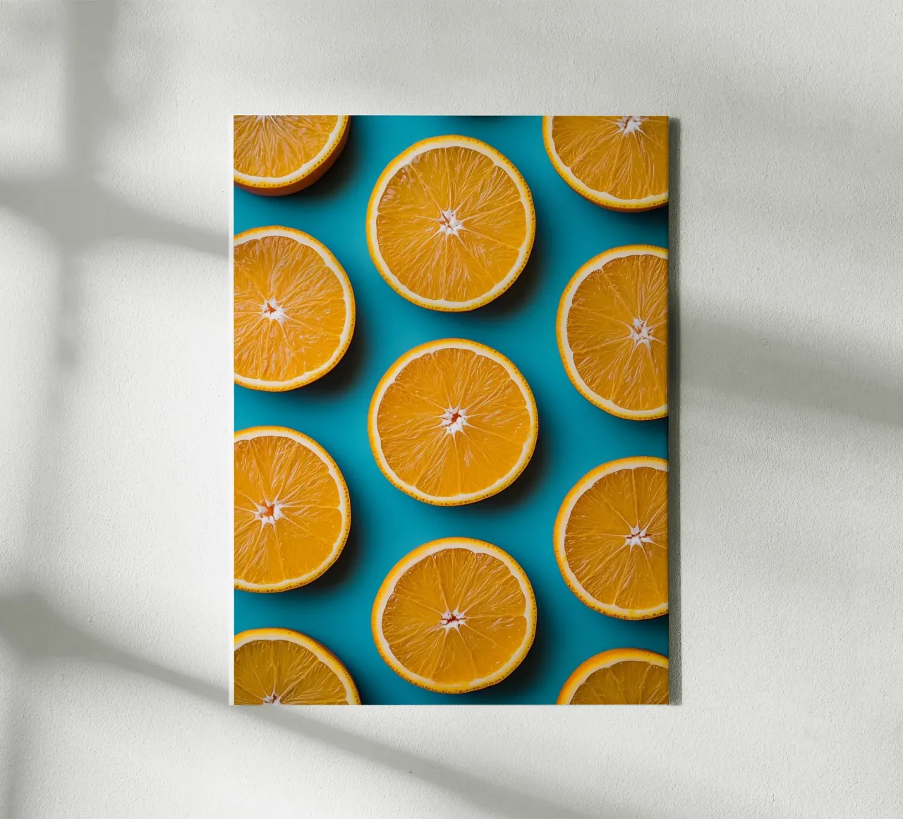 Sliced oranges on a turquoise background canvas by Spice & Style