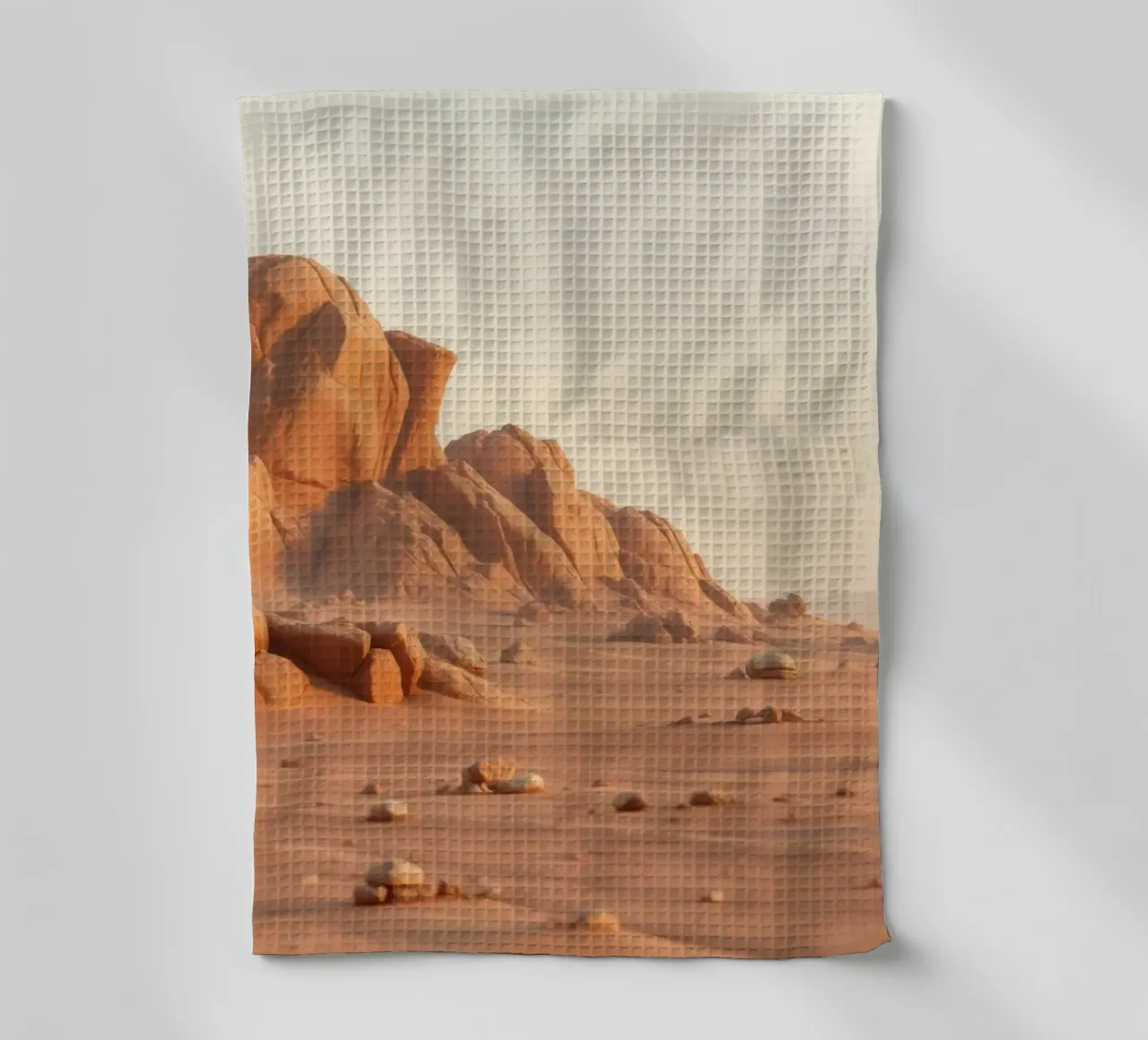 Un vaste paysage désertique avec des formations rocheuses uniques torchon de DesignDoodle
