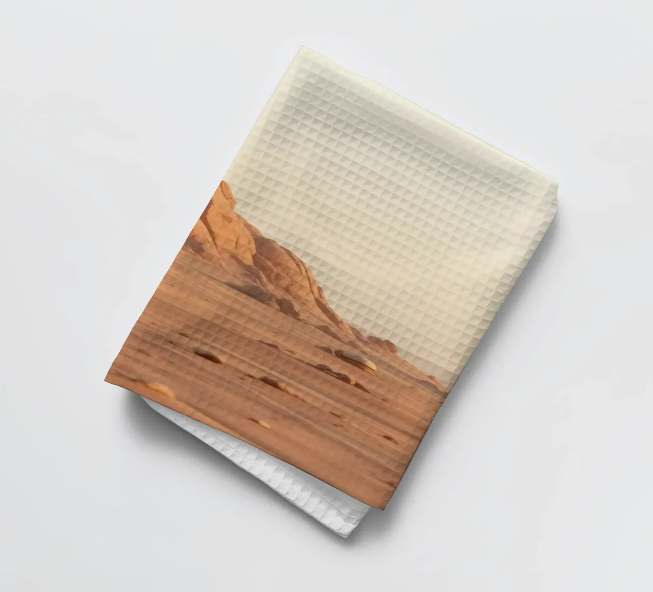 Un vaste paysage désertique avec des formations rocheuses uniques torchon de DesignDoodle