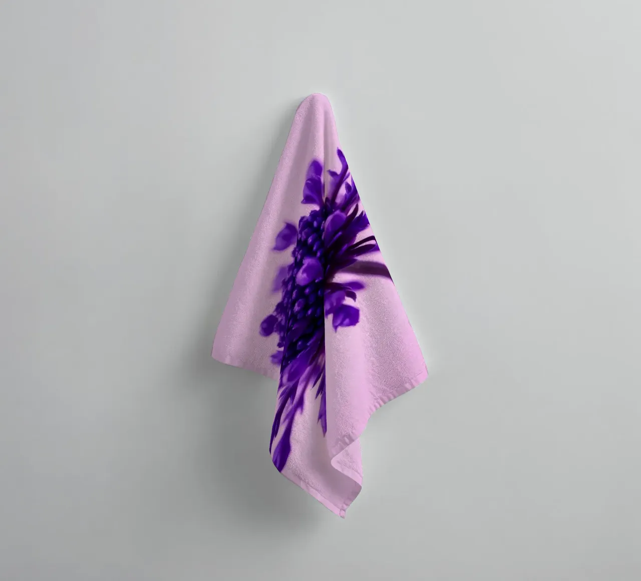 Purple flower stands against a soft pink background towel by DesignDoodle