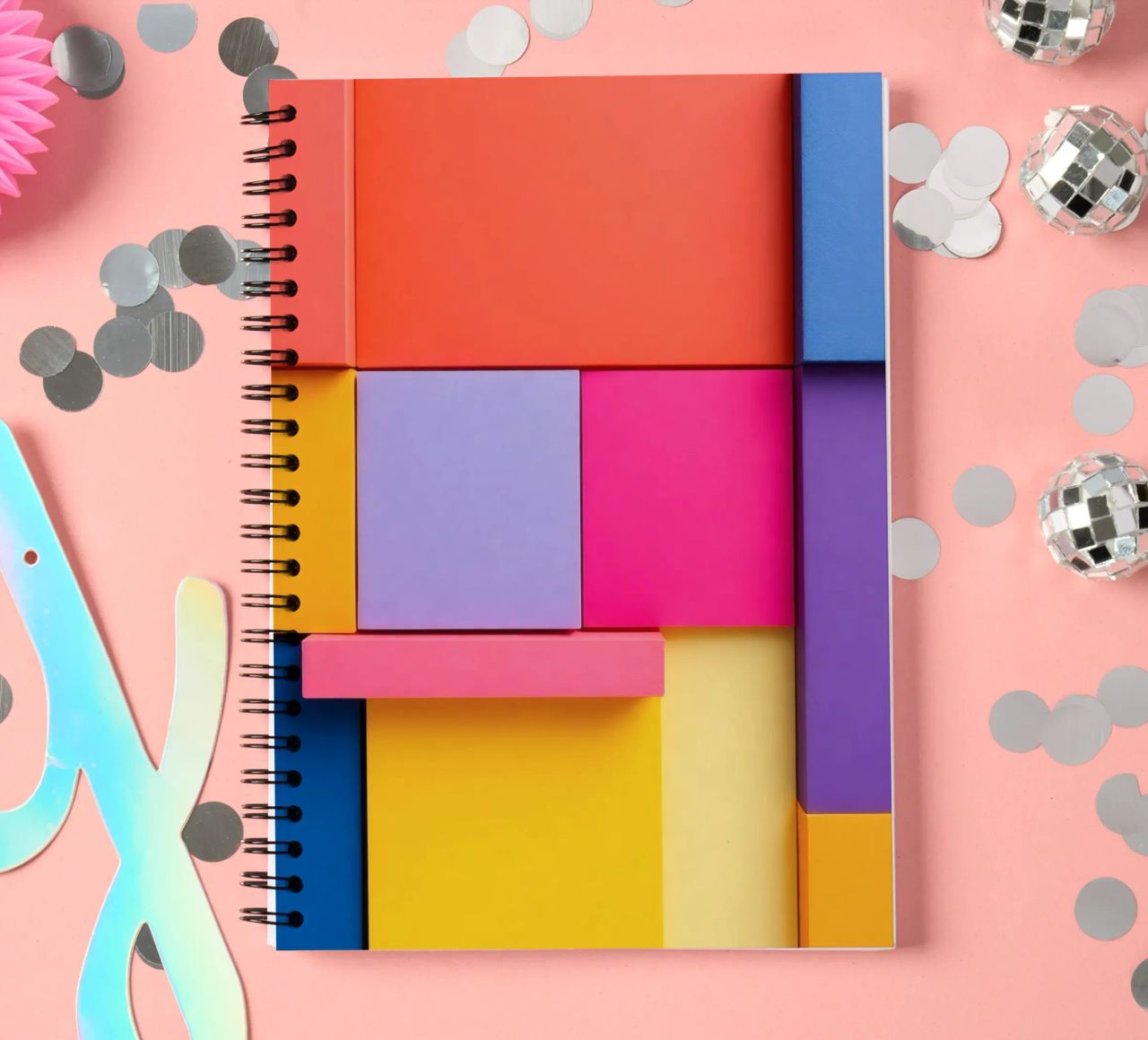 Colorful geometric shapes create a vibrant abstract design spiral notebook by DesignDoodle
