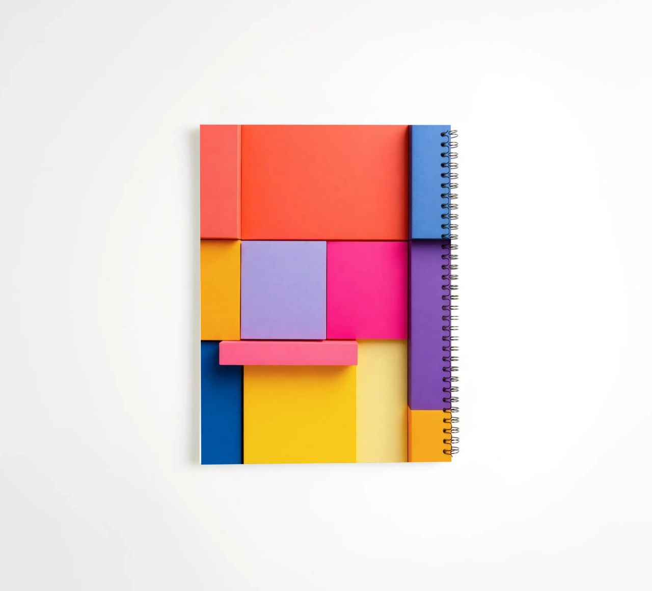 Colorful geometric shapes create a vibrant abstract design spiral notebook by DesignDoodle