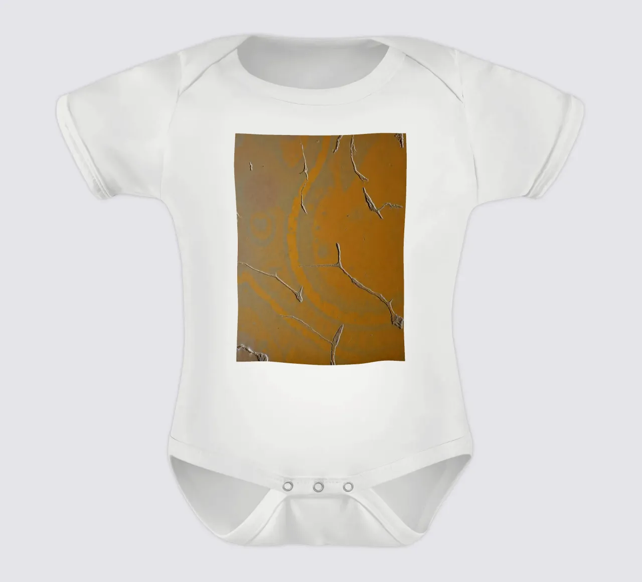 Textured surface shows cracks and patterns in warm tones short-sleeve baby romper by DesignDoodle