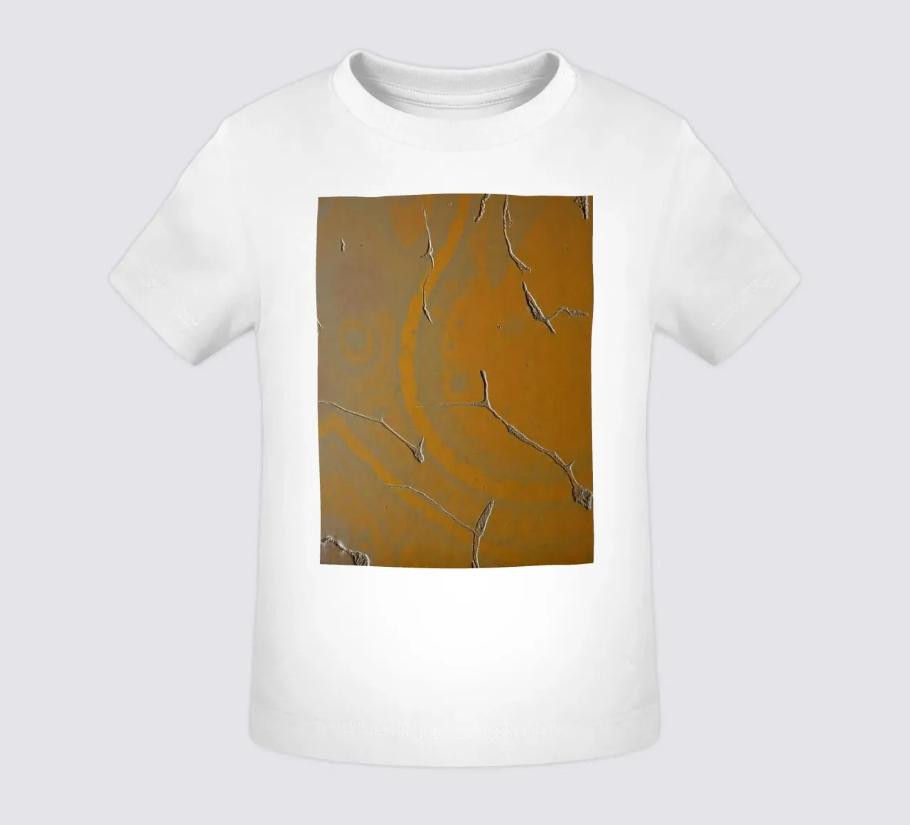 Textured surface shows cracks and patterns in warm tones baby t-shirt by DesignDoodle