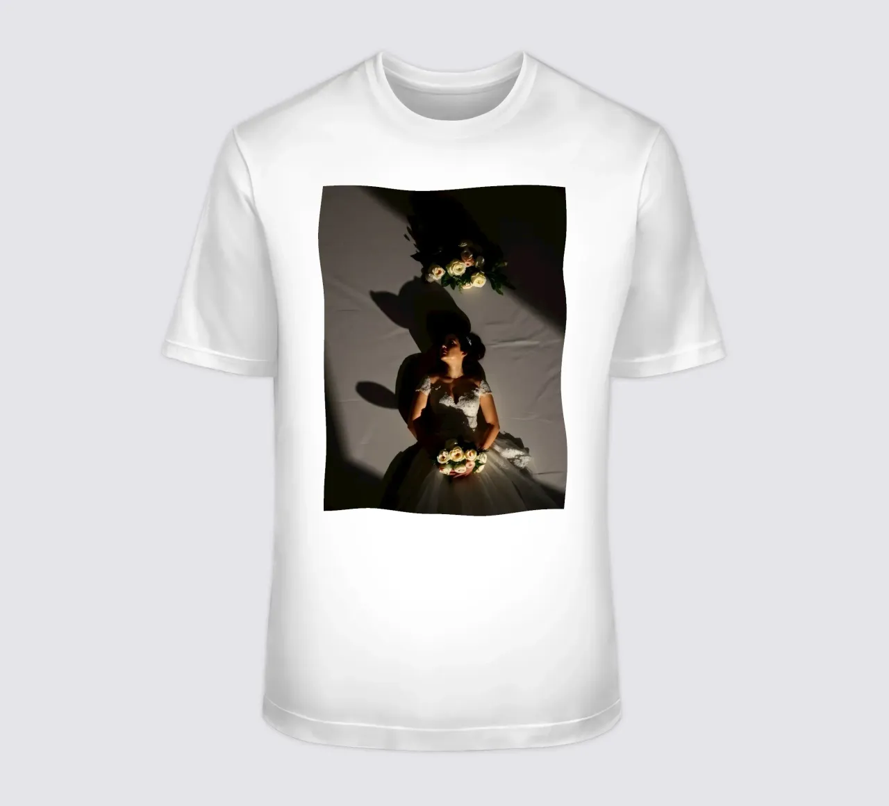 Bride in elegant gown poses dramatically under soft lighting t-shirt by DesignDoodle