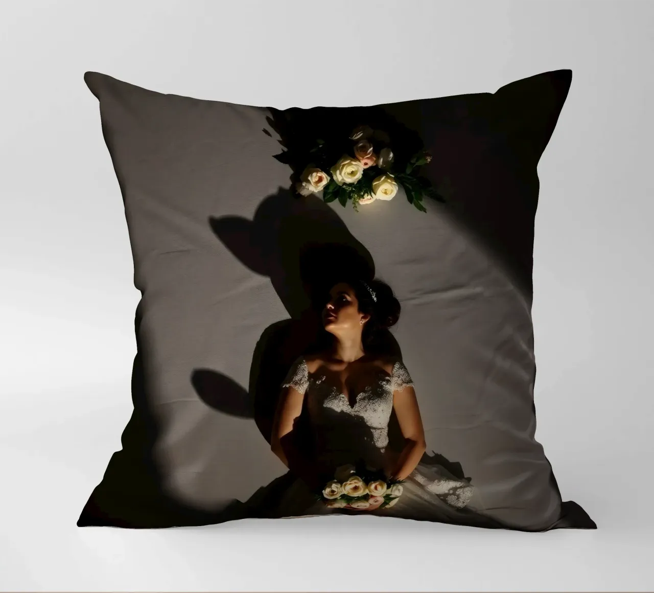 Bride in elegant gown poses dramatically under soft lighting decorative cushion by DesignDoodle