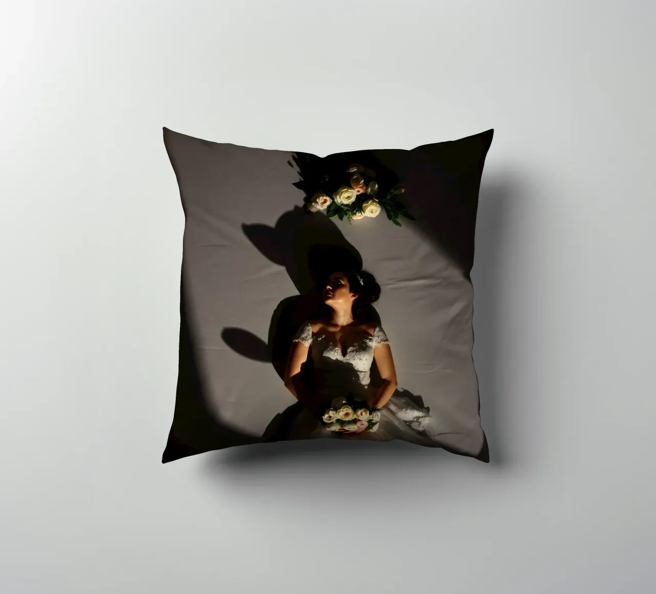 Bride in elegant gown poses dramatically under soft lighting decorative cushion by DesignDoodle