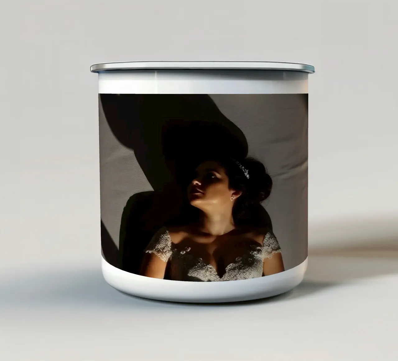 Bride in elegant gown poses dramatically under soft lighting enamel mug by DesignDoodle