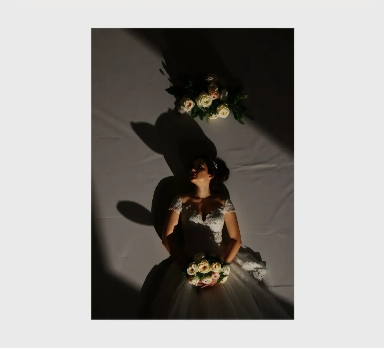 Bride in elegant gown poses dramatically under soft lighting notebook by DesignDoodle