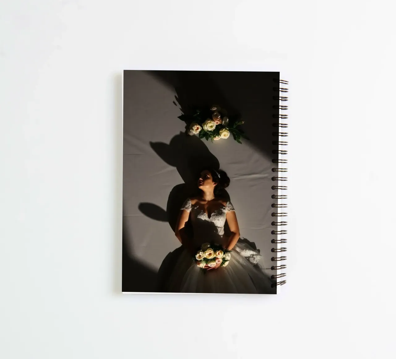 Bride in elegant gown poses dramatically under soft lighting spiral notebook by DesignDoodle