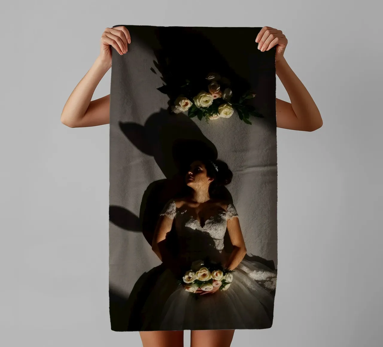 Bride in elegant gown poses dramatically under soft lighting towel by DesignDoodle