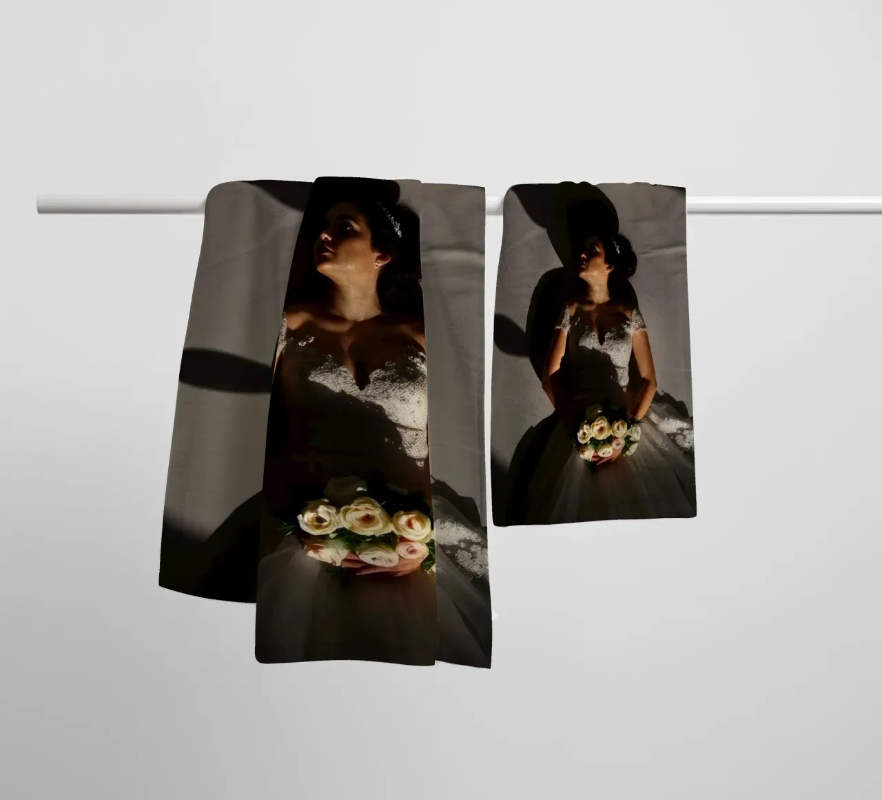 Bride in elegant gown poses dramatically under soft lighting towel by DesignDoodle
