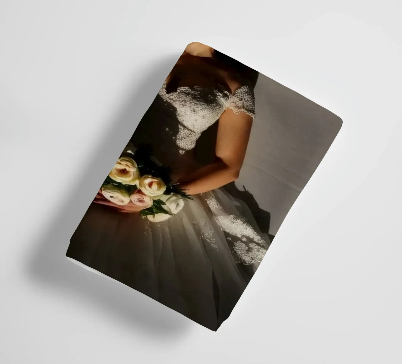 Bride in elegant gown poses dramatically under soft lighting towel by DesignDoodle