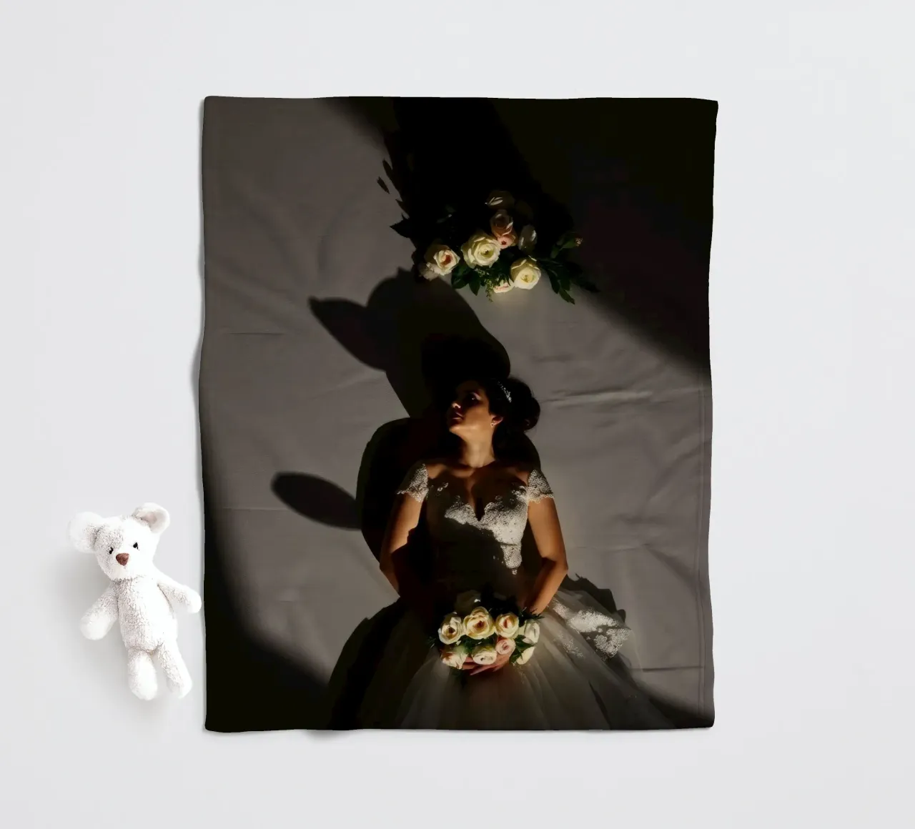 Bride in elegant gown poses dramatically under soft lighting fleece blanket by DesignDoodle