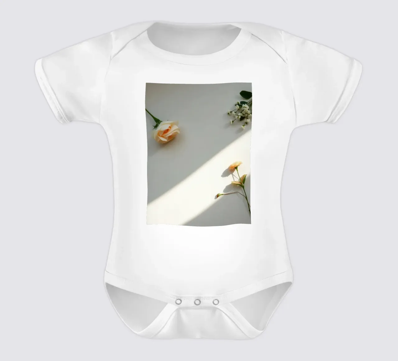 Delicate arrangement of flowers on a light surface short-sleeve baby romper by DesignDoodle