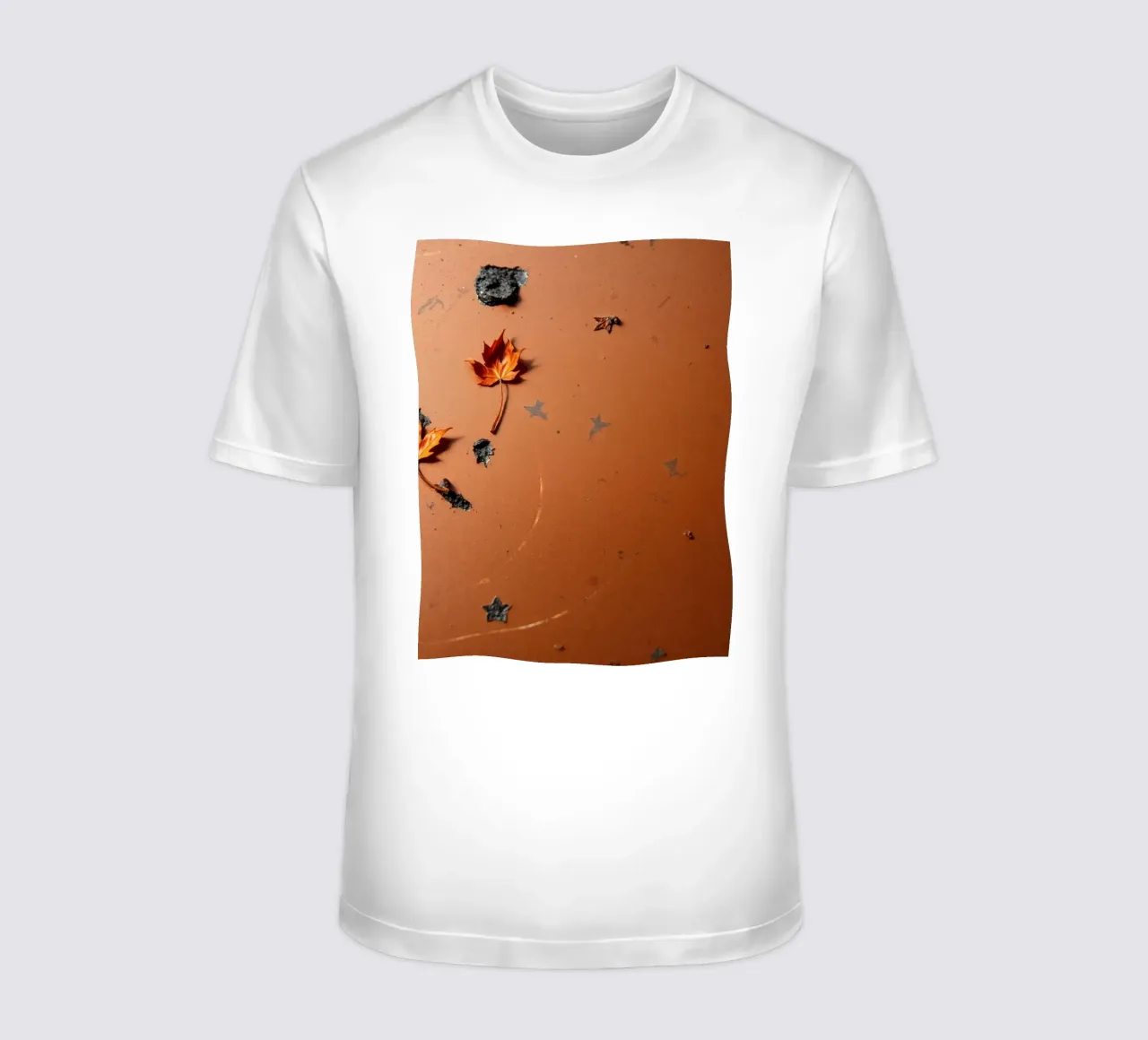 Feuilles d'automne colorées sur une surface rustique avec un motif étoilé t-shirt de DesignDoodle