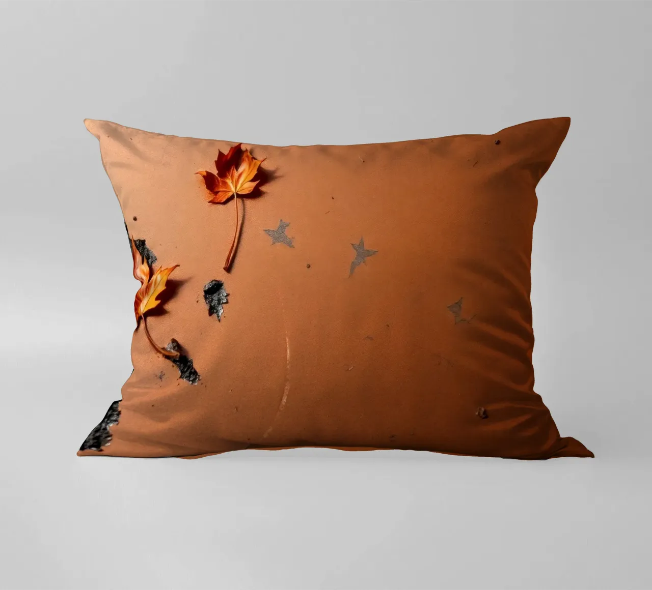Feuilles d'automne colorées sur une surface rustique avec un motif étoilé coussin de DesignDoodle