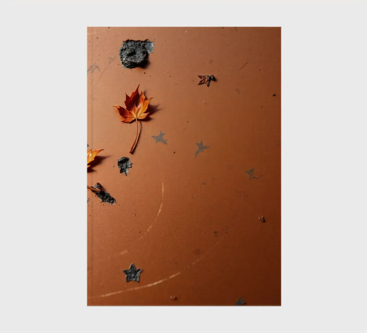 Colorful autumn leaves on a rustic surface with star pattern notebook by DesignDoodle