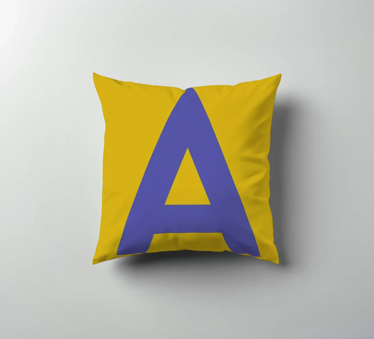 Yellow Letter A decorative cushion by Studio One