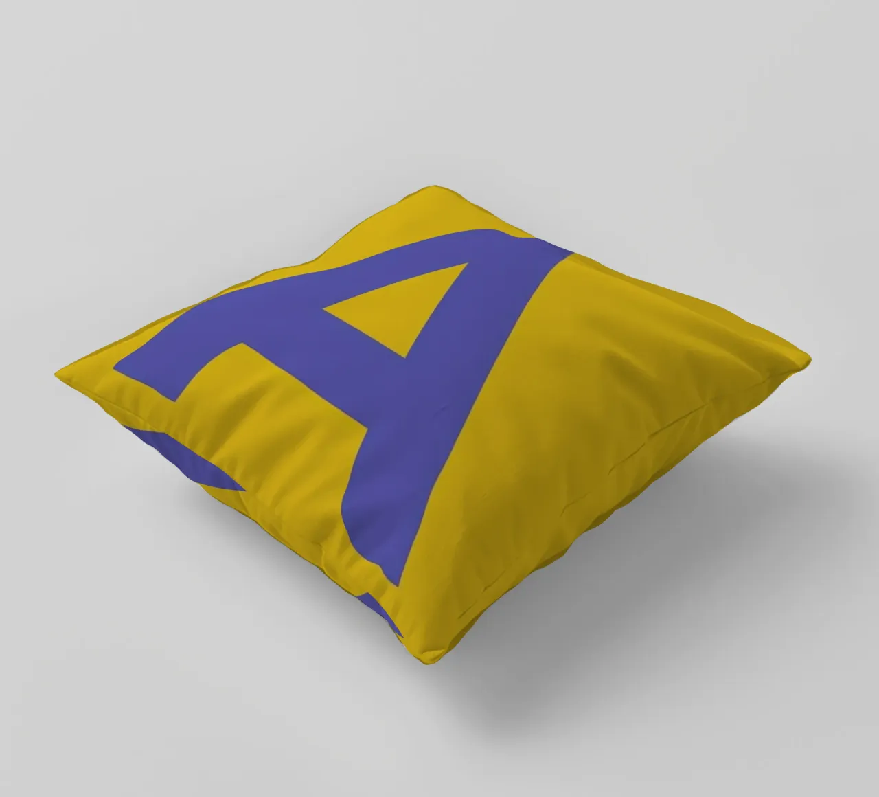 Yellow Letter A decorative cushion by Studio One