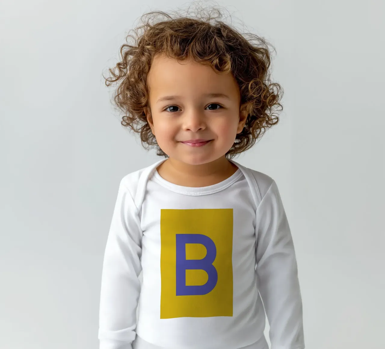 Yellow Letter B long-sleeve baby romper by Studio One