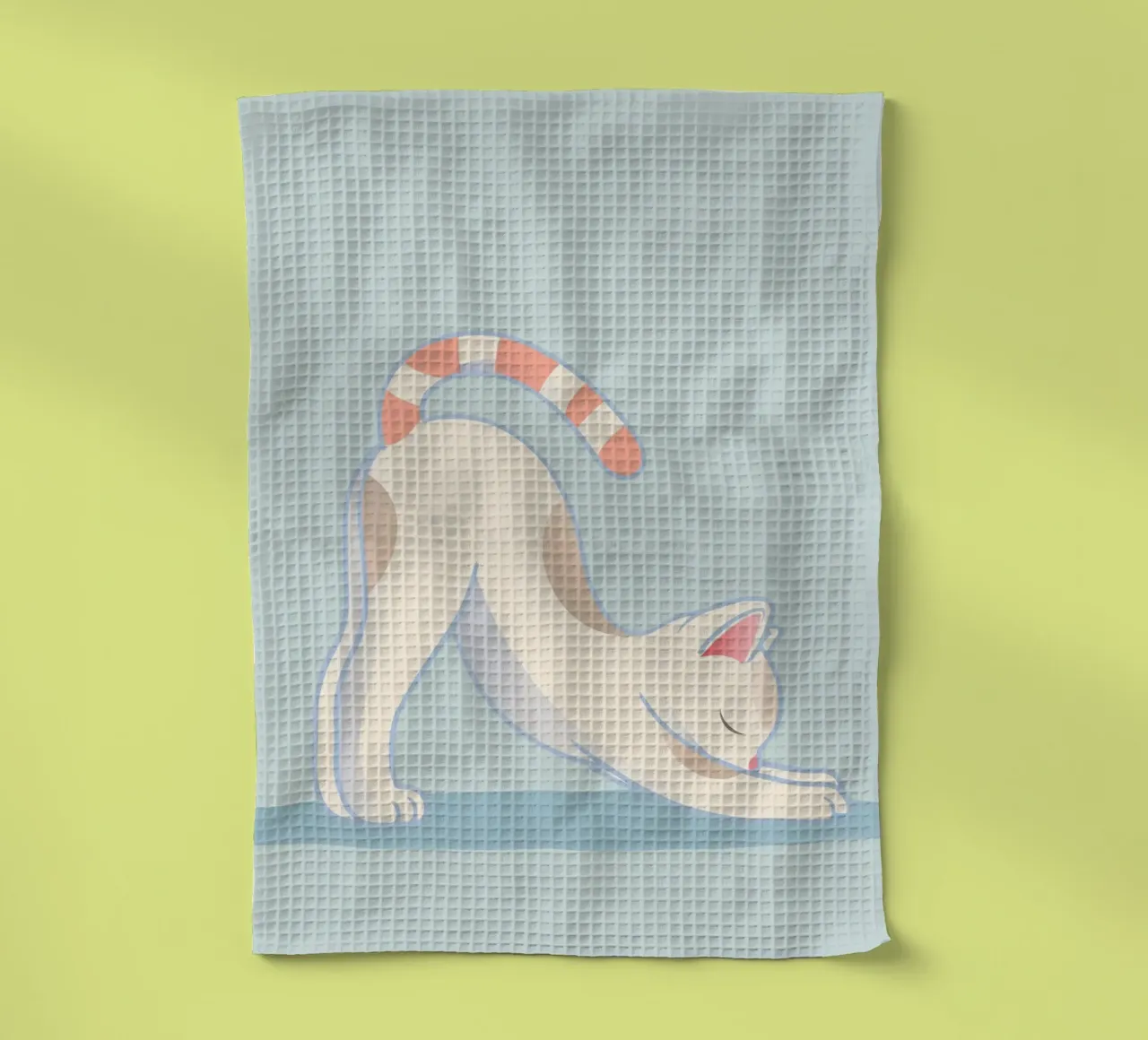 Chat dans une pose d'étirement de yoga - étirement et relaxation torchon de namosh