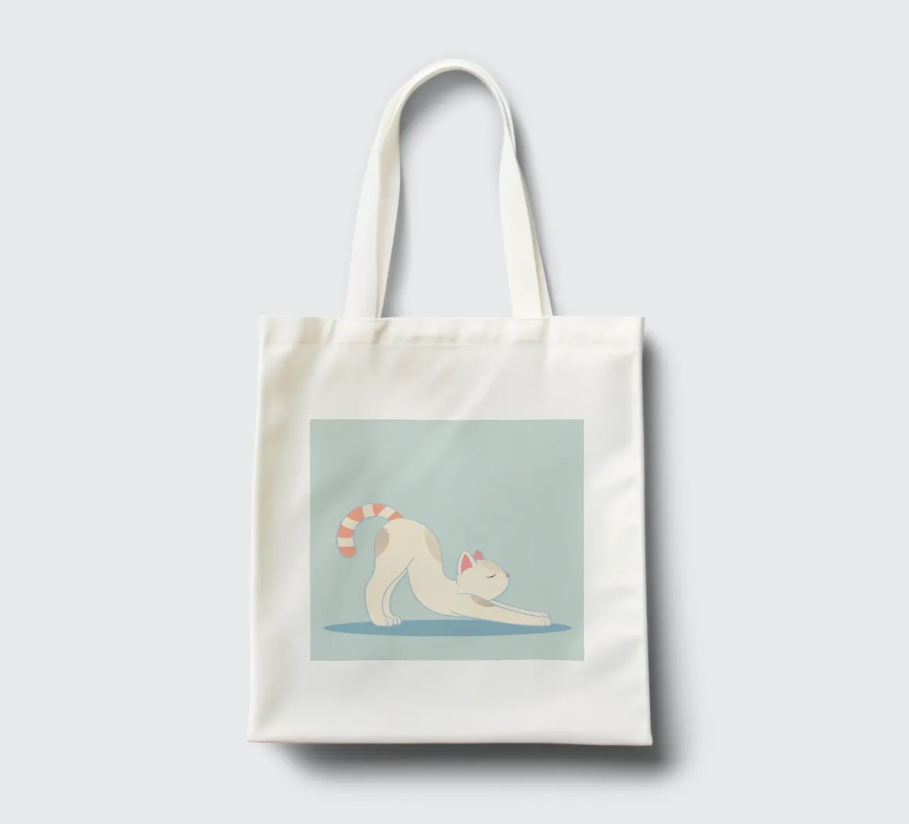 chat mignon dans la pose d'étirement classique du yoga tote bag de namosh