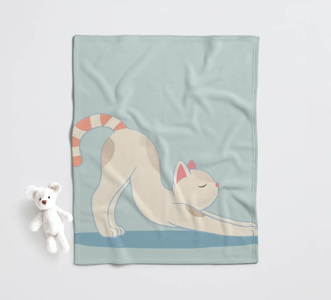 chat mignon dans la pose d'étirement classique du yoga plaid polaire de namosh
