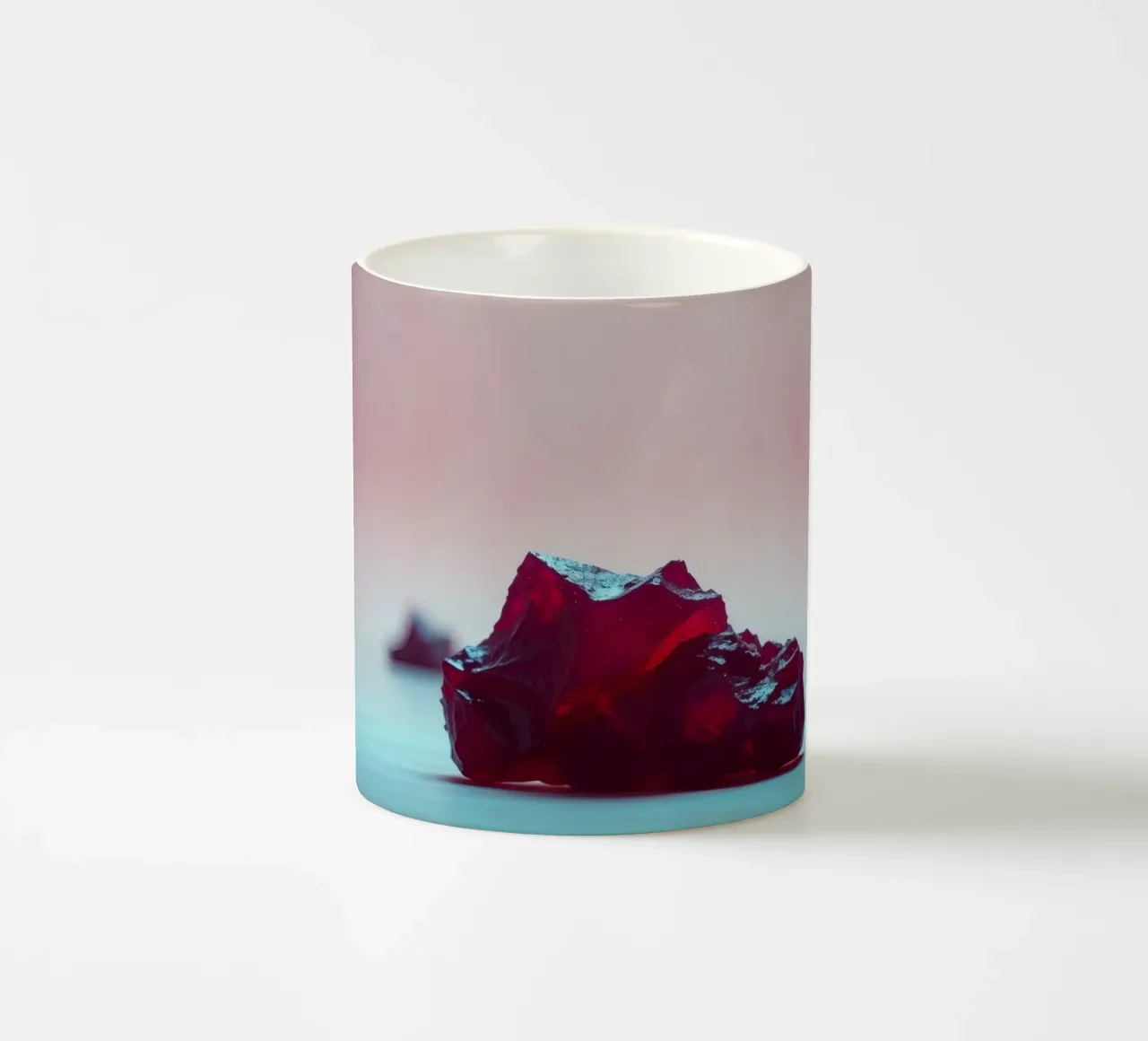 Bright red gelatin cubes scattered on a soft surface ceramic mug by DesignDoodle
