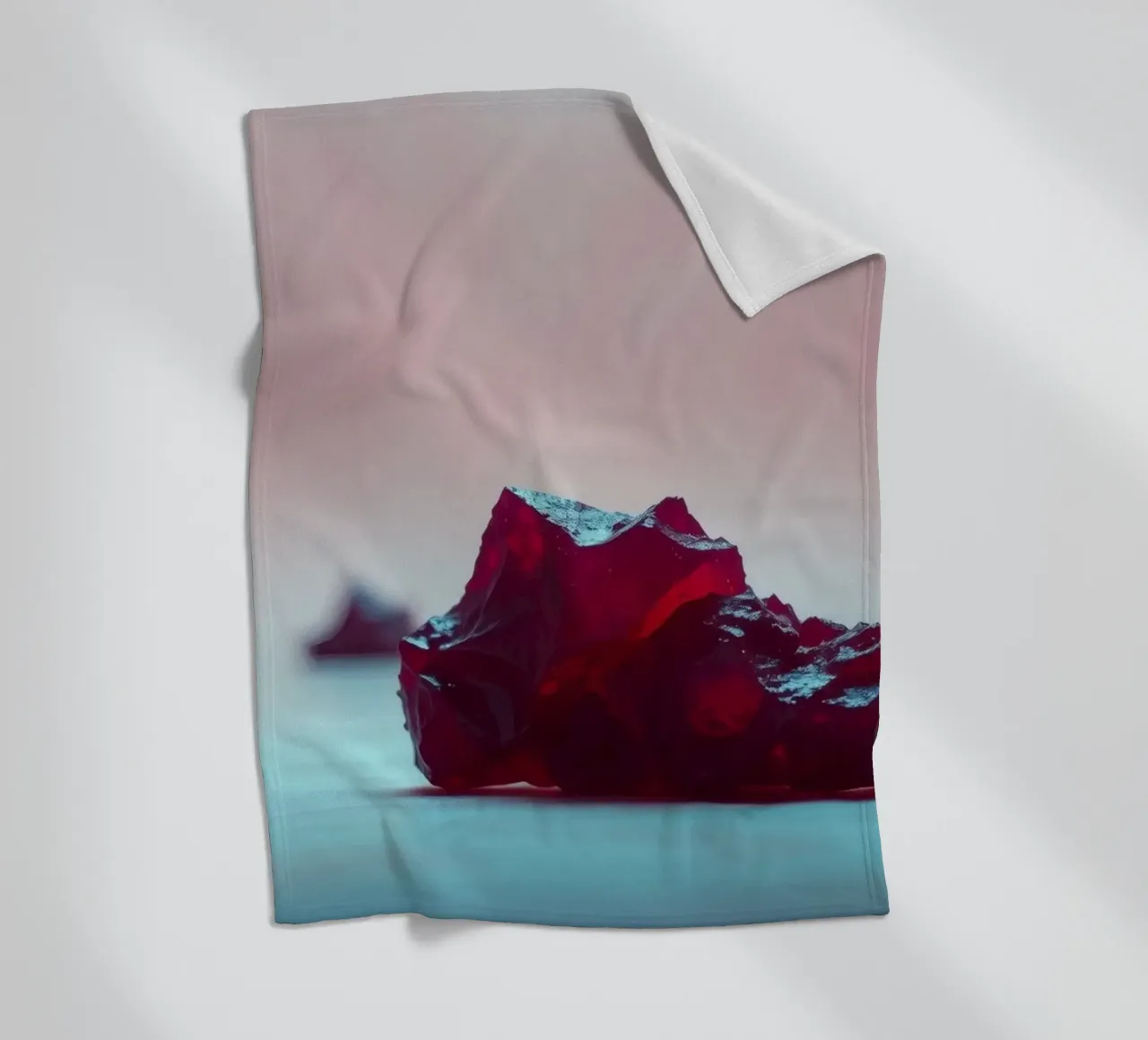 Bright red gelatin cubes scattered on a soft surface fleece blanket by DesignDoodle