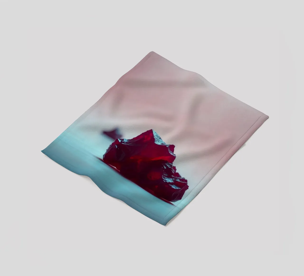 Bright red gelatin cubes scattered on a soft surface fleece blanket by DesignDoodle