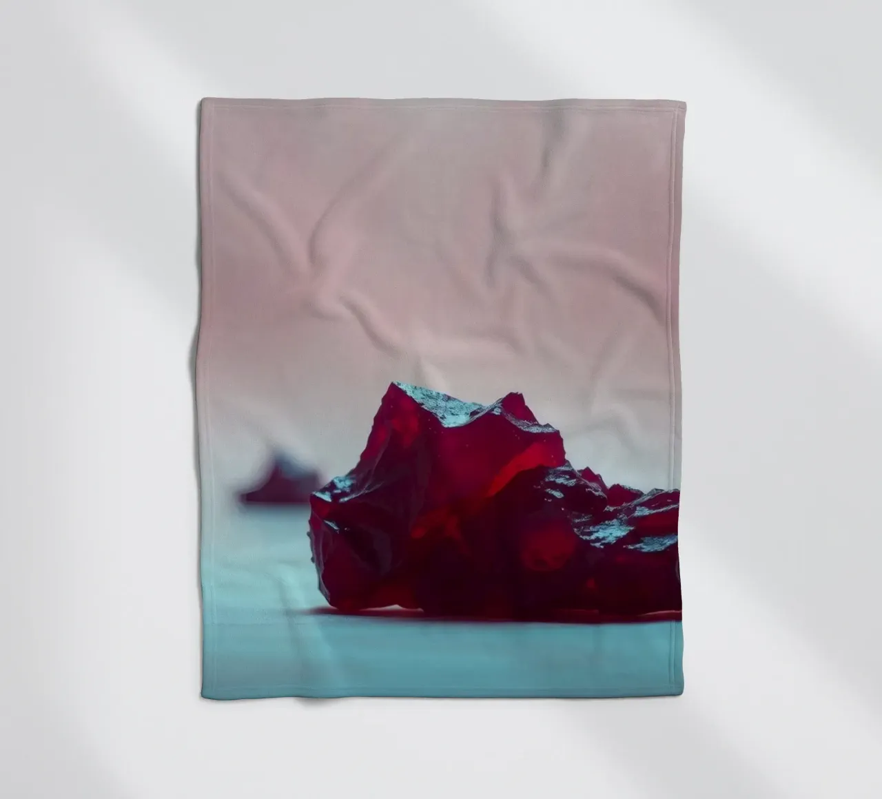 Bright red gelatin cubes scattered on a soft surface fleece blanket by DesignDoodle