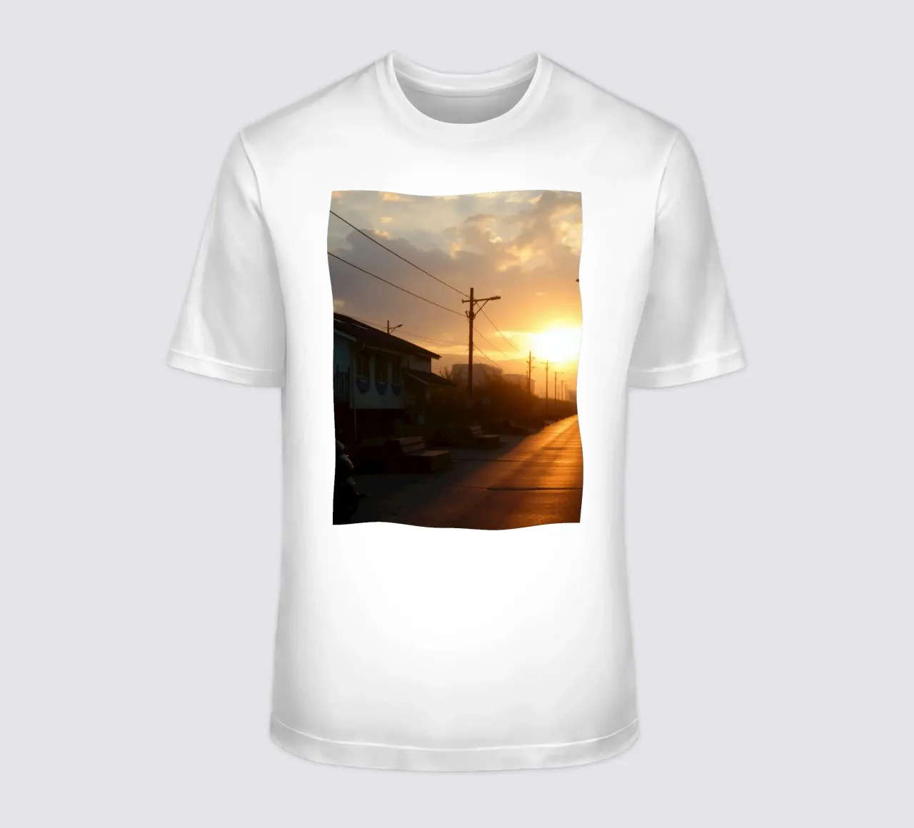 Sunset casts a golden glow over a quiet street lined t-shirt by DesignDoodle
