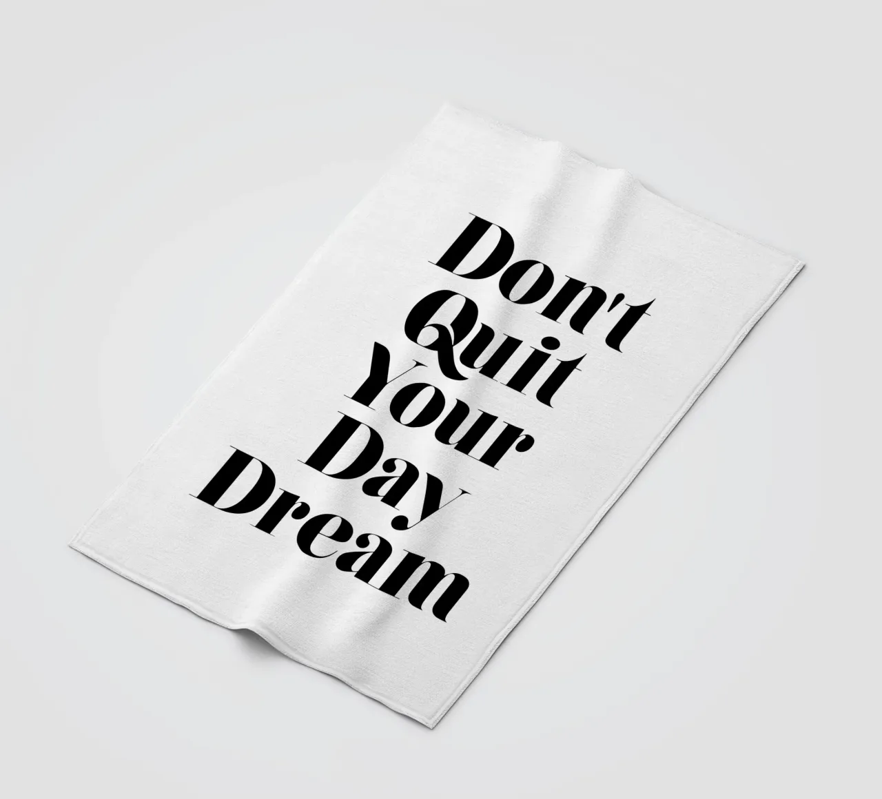 Don't Quit Your Daydream Design tipografico in caratteri neri coperta in pile da THE MOTIVATED TYPE