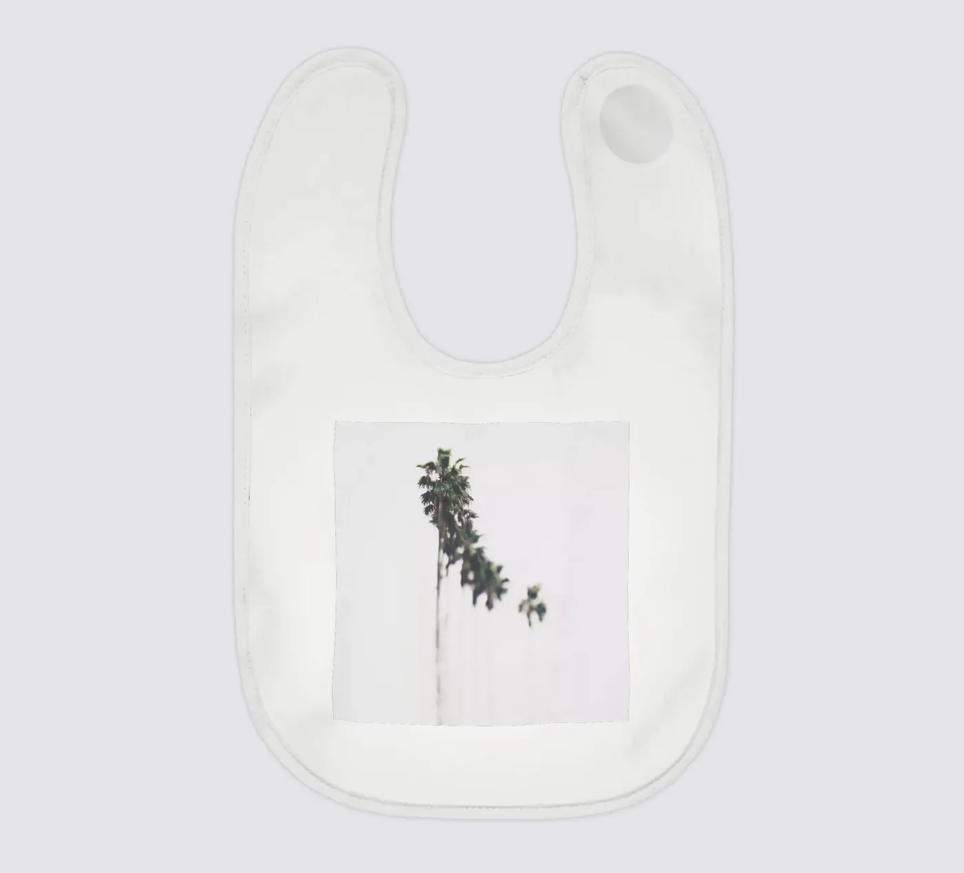 Palms baby slabbetje van Ingrid Beddoes