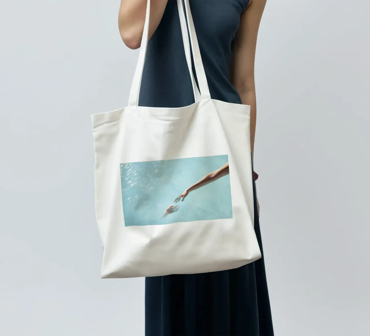 Water Sparkle - Surreal Hands Touch tote bag by Ingrid Beddoes
