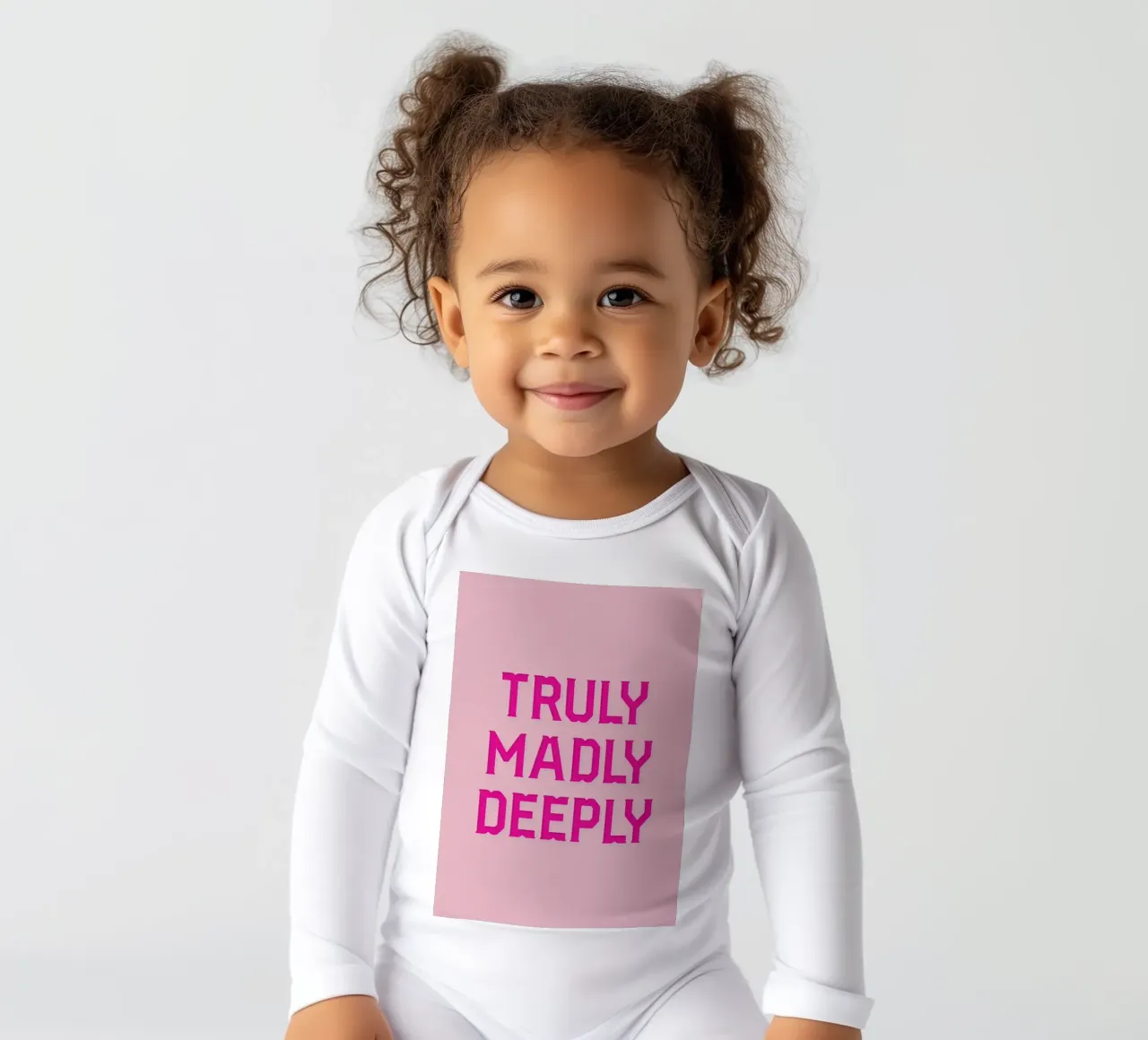 Truly Madly long-sleeve baby romper by Honeymoon Hotel