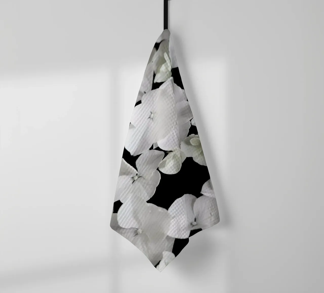 White Beauty On Black tea towel by Studio Nahili