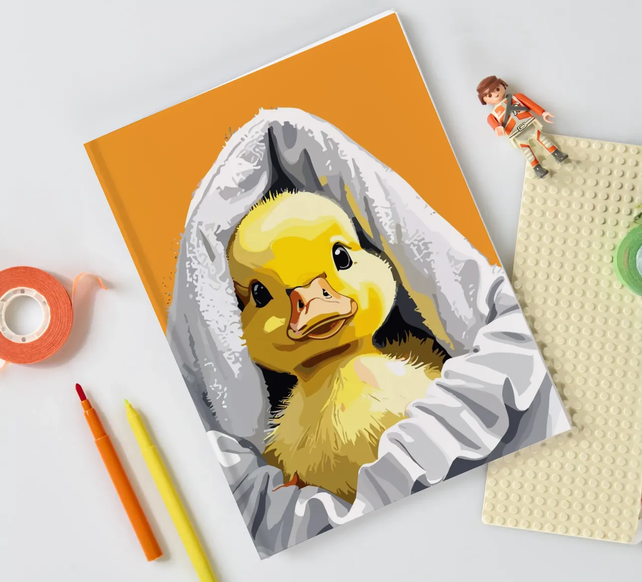 Duckling peeking from under a soft Notizbuch von LisaArtes