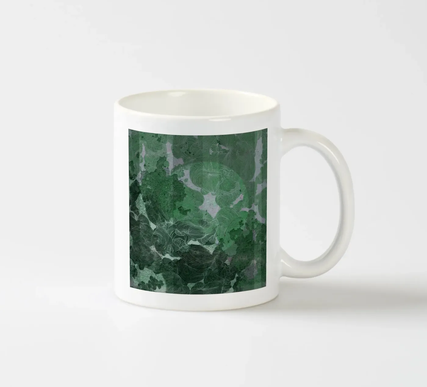 green ceramic mug by Giulio Iurissevich