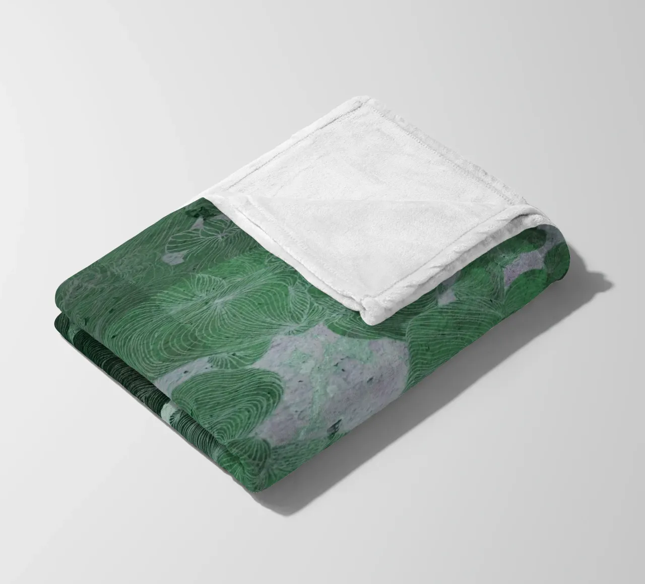 green fleece blanket by Giulio Iurissevich