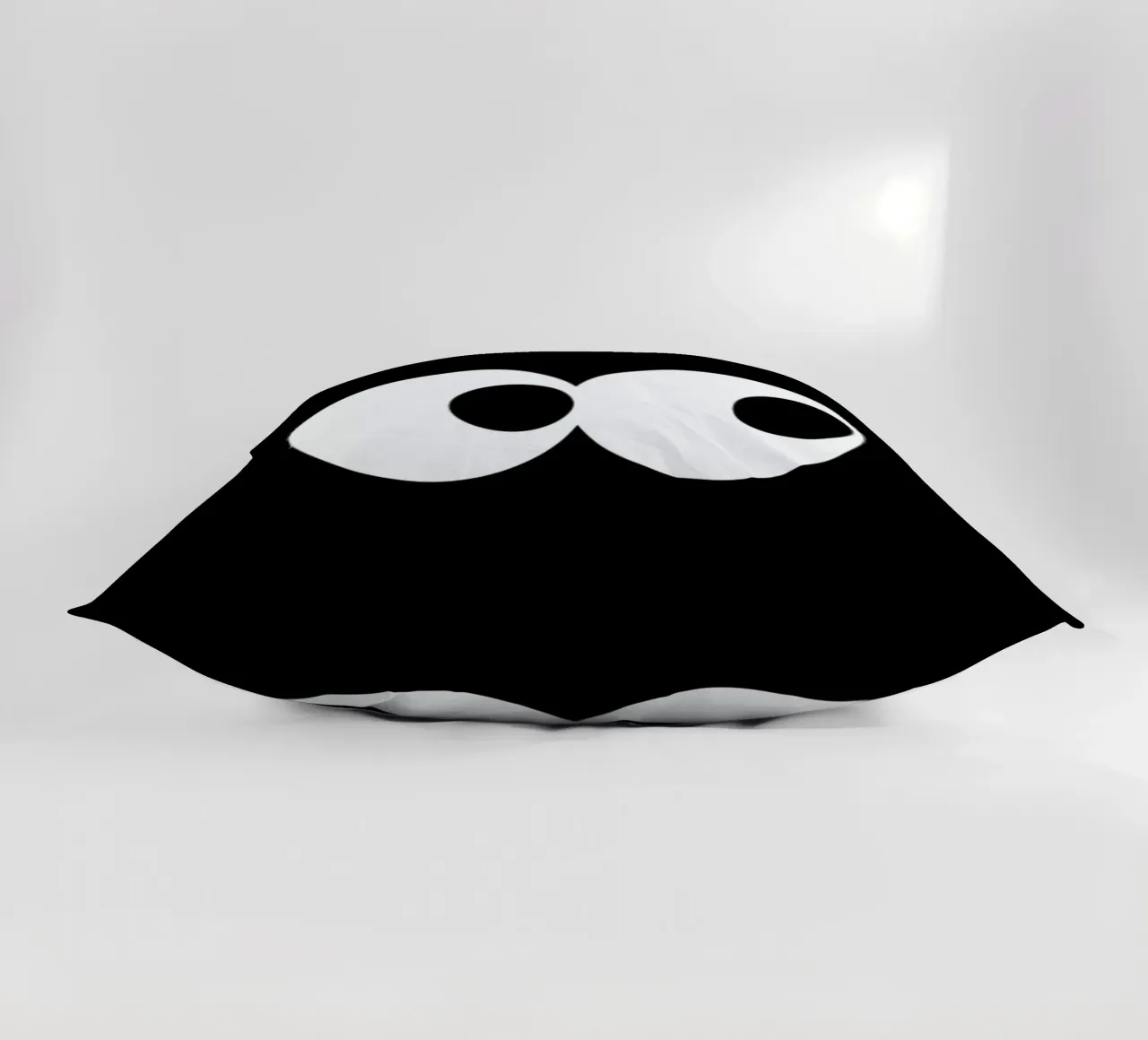 Black Eyes decorative cushion by The Poster Kid