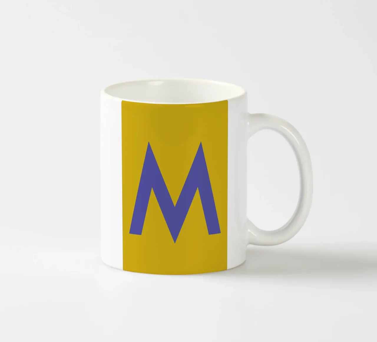 Yellow Letter M ceramic mug by Studio One