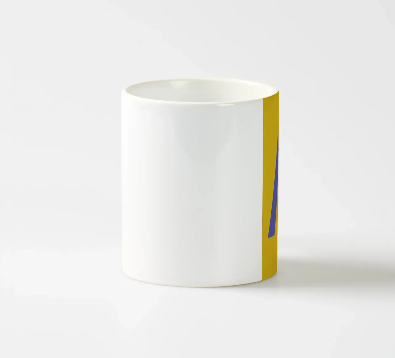 Yellow Letter M ceramic mug by Studio One