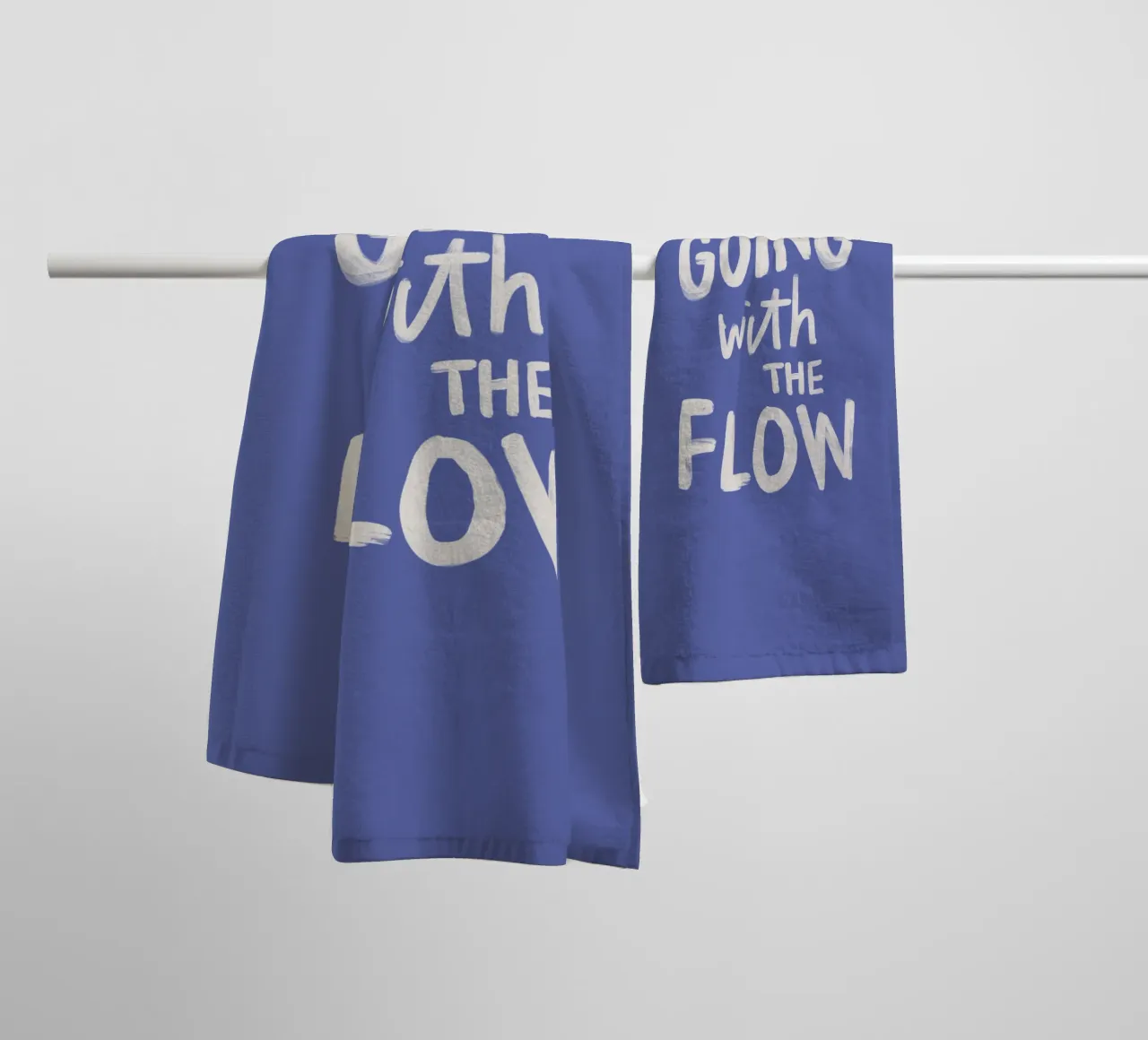Going with the Flow, design tipografico dipinto a mano in blu asciugamano da bagno da THE MOTIVATED TYPE