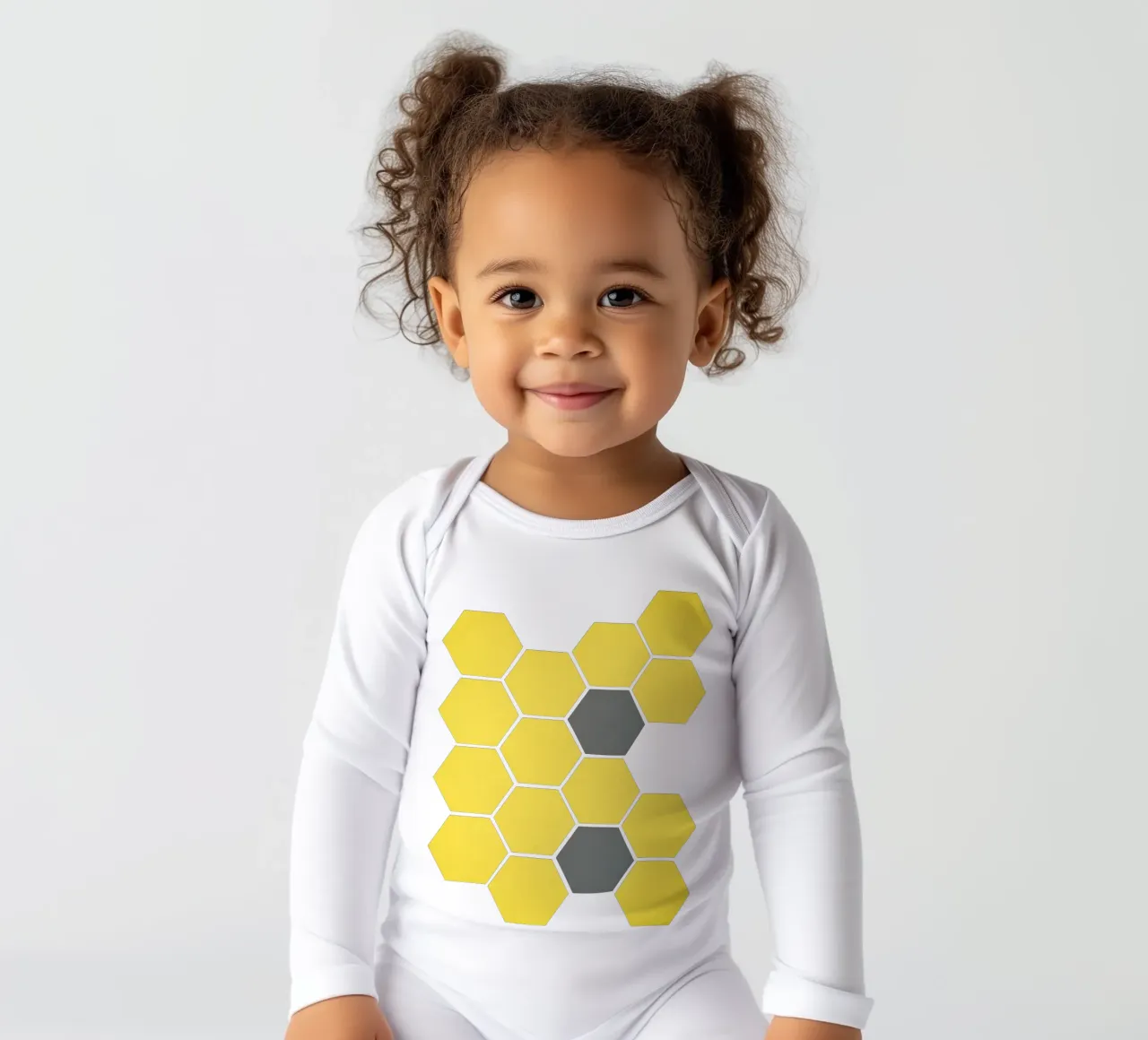 Yellow Honeycomb long-sleeve baby romper by Cassia Beck Collage