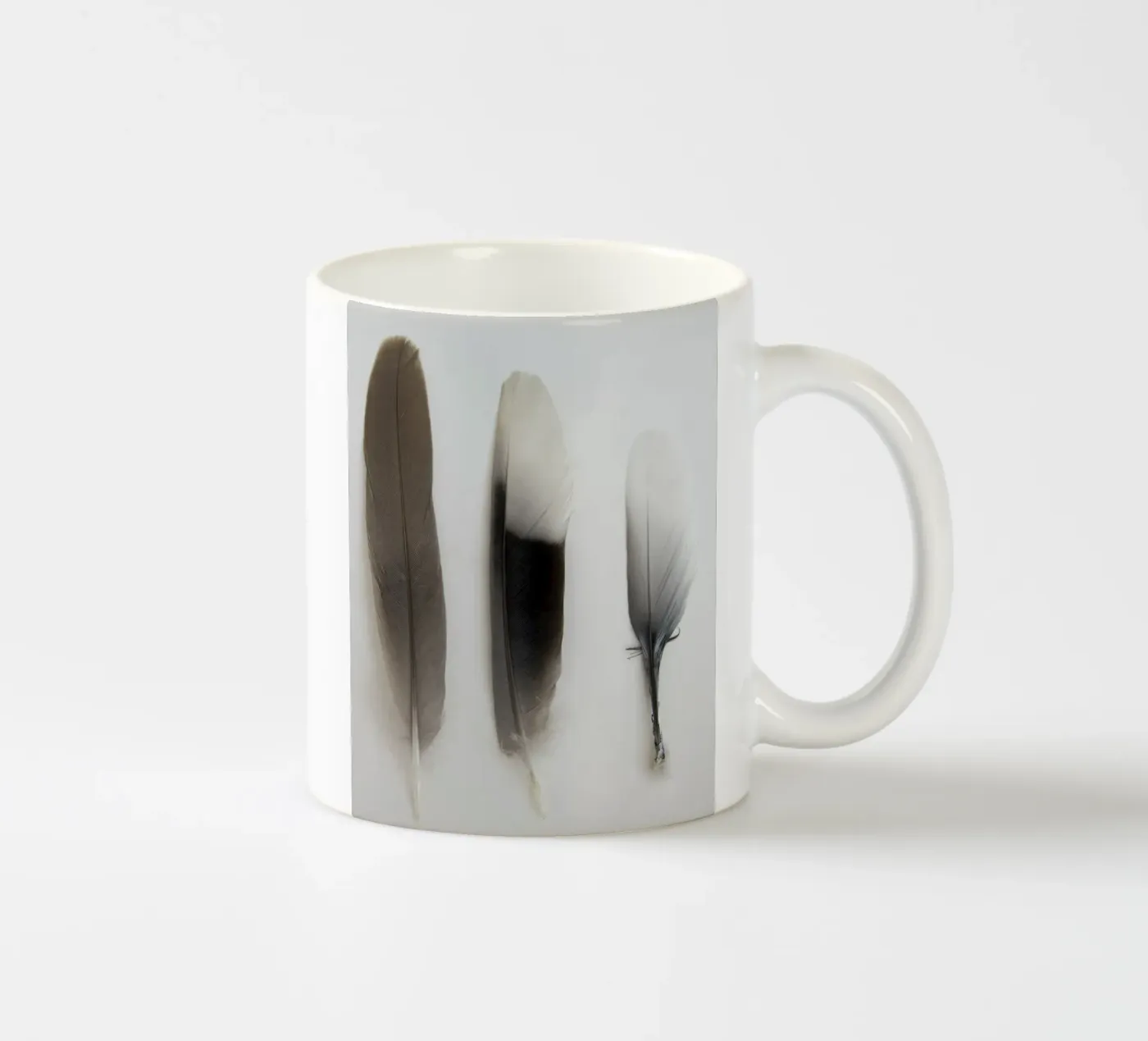Feathers ceramic mug by Teresa André