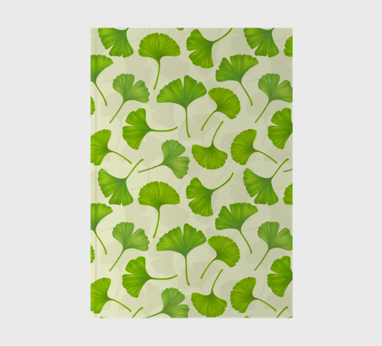 Ginkgo leaves on off white notebook by Painted Nature