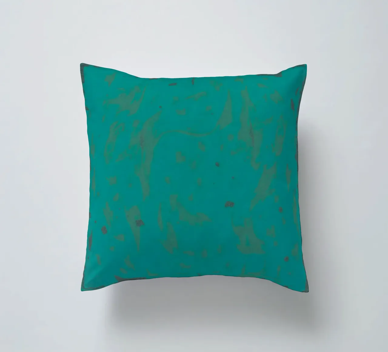 Bright turquoise background with subtle texture decorative cushion by DesignDoodle