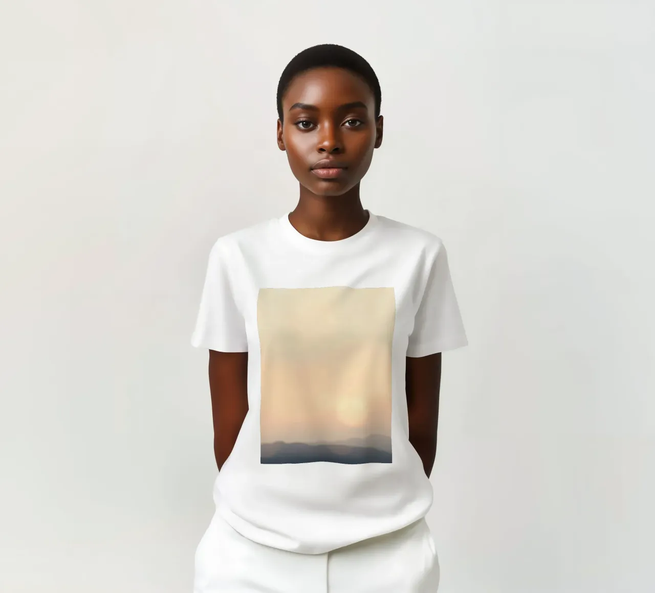Sunset casting a warm glow over distant mountains and cloude t-shirt by DesignDoodle